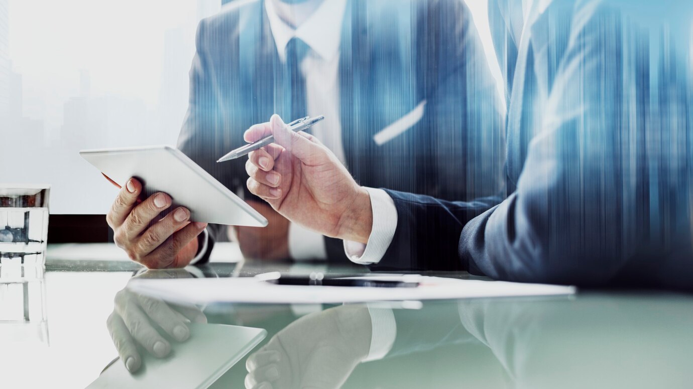 corporate-businessmen-working-tablet-office_53876-97637